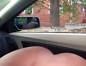 Sexy chick sucks cock in car with her ass out