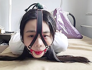 Chinese Girl Close by Bondage