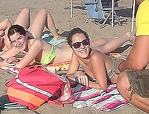 Spanish chicks seduced on a beach