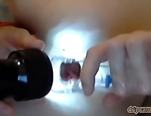 Russian girl using anal speculum on webcam